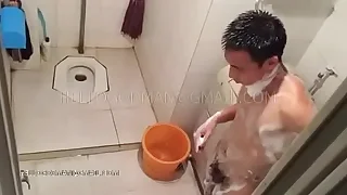 Adult Chinese man attracting a shower