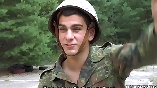 Young gays in uniform exchange blowjobs atop the roadside